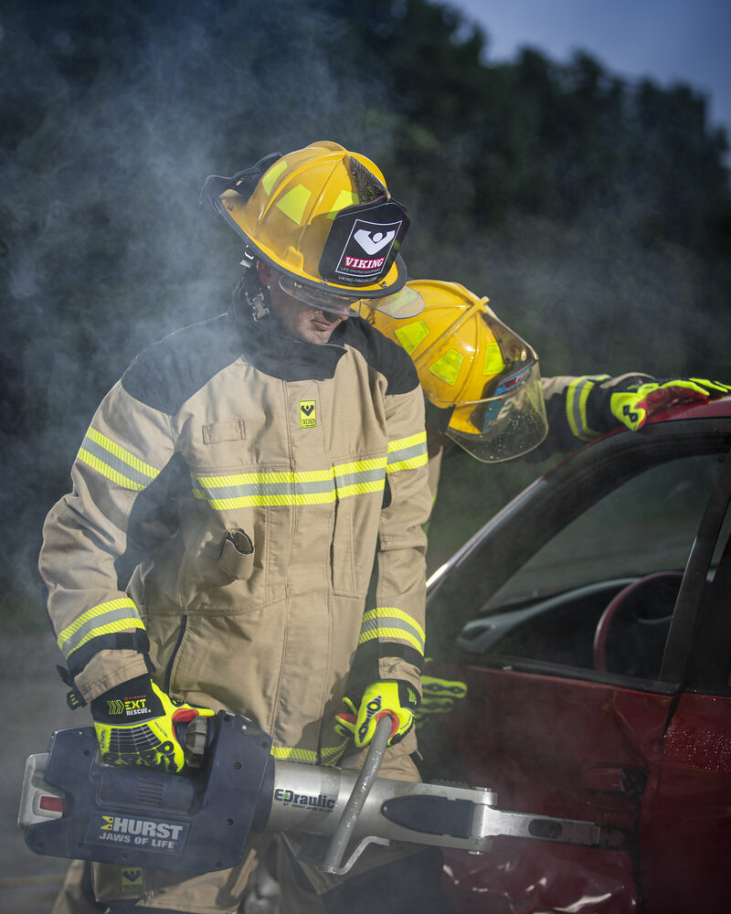 Firefighter using the Jaws of Life at a vehicle rescue, fire service photography by Mind Shift