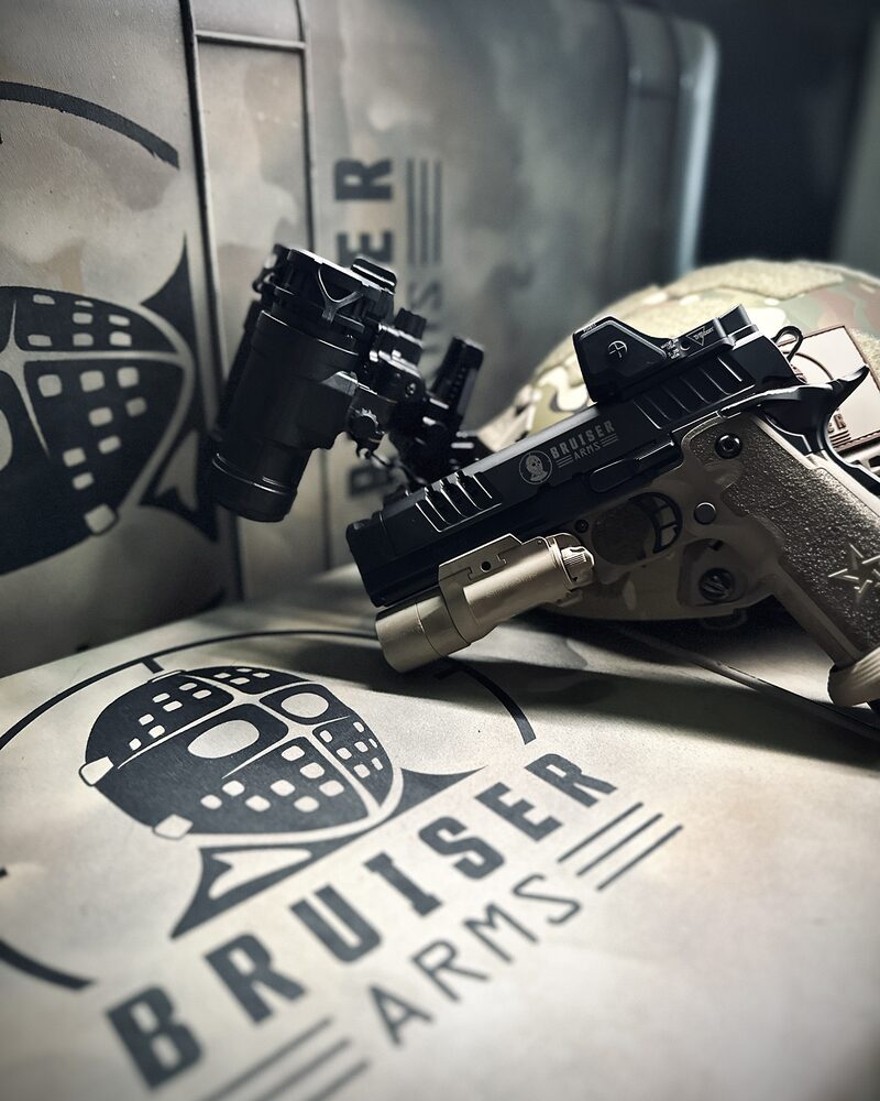 Pistol staged with night vision and tactical kit, firearms and tactical gear photography by Mind Shift