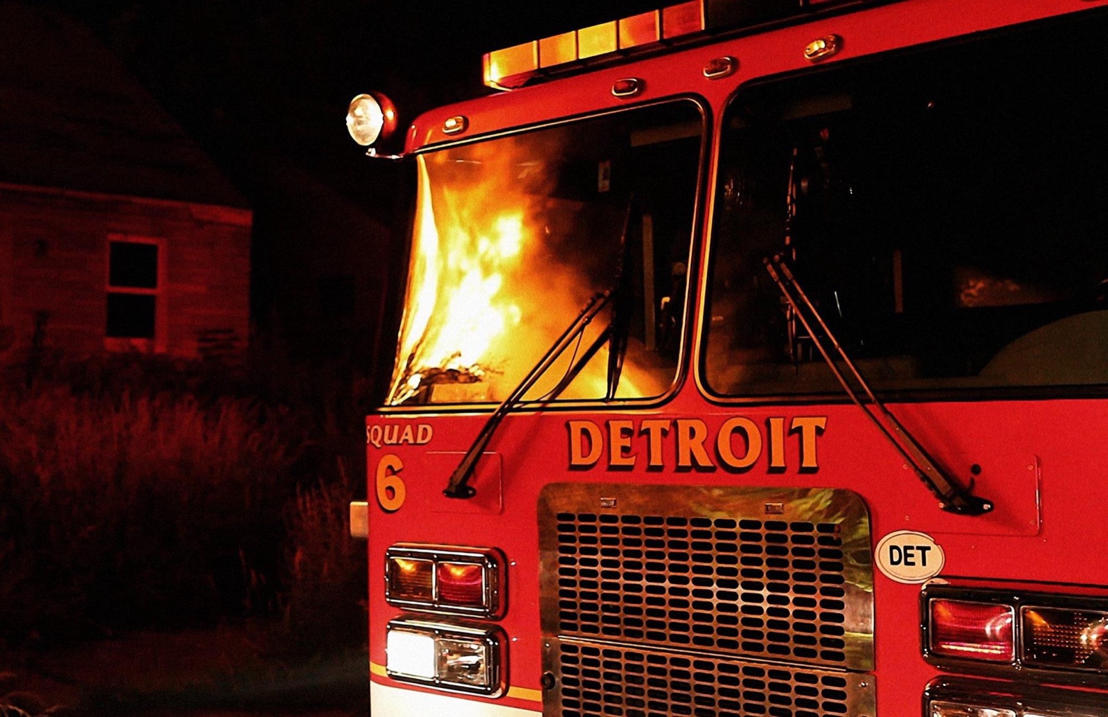 Detroit fire engine at night with flames visible during BURN X
