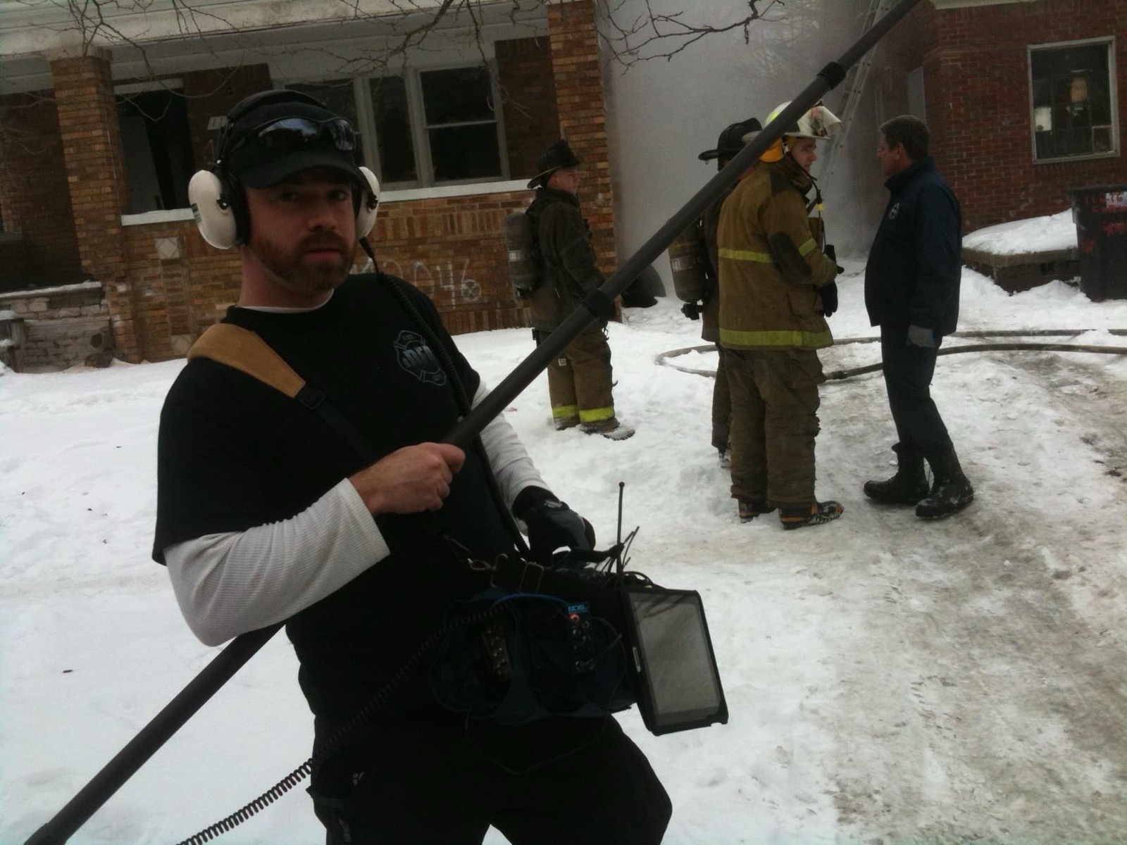 Sound operator with boom mic at a Detroit fire scene during BURN production